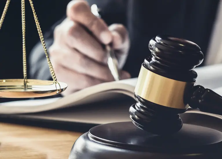 A gavel and a gavel on a book