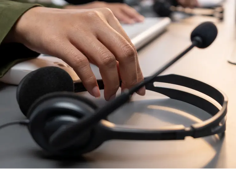 A hand holding a microphone